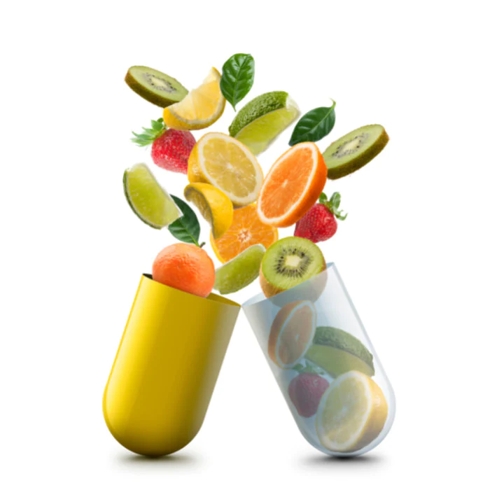 Fruits et légumes sortant d'une gélule, illustration des vitamines et minéraux